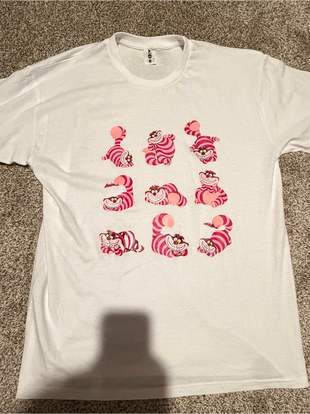 NWOT Women’s White T-Shirt with Pink Cheshire Cat Grid